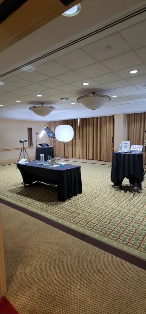 Professional headshot lounge setup with lighting equipment