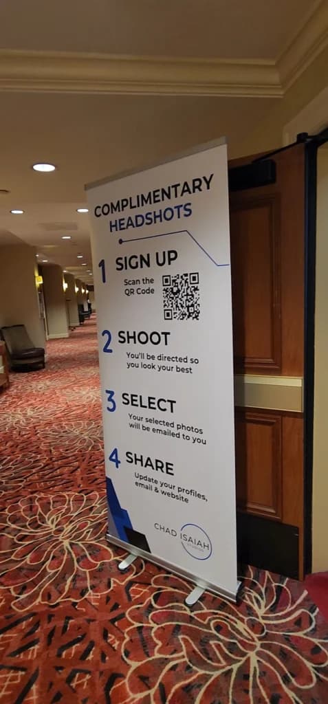 Headshot lounge signage with QR code for sign-up