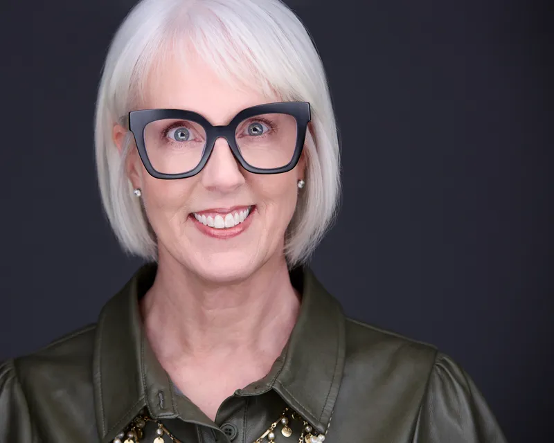 Corporate headshot of female professional with confident expression