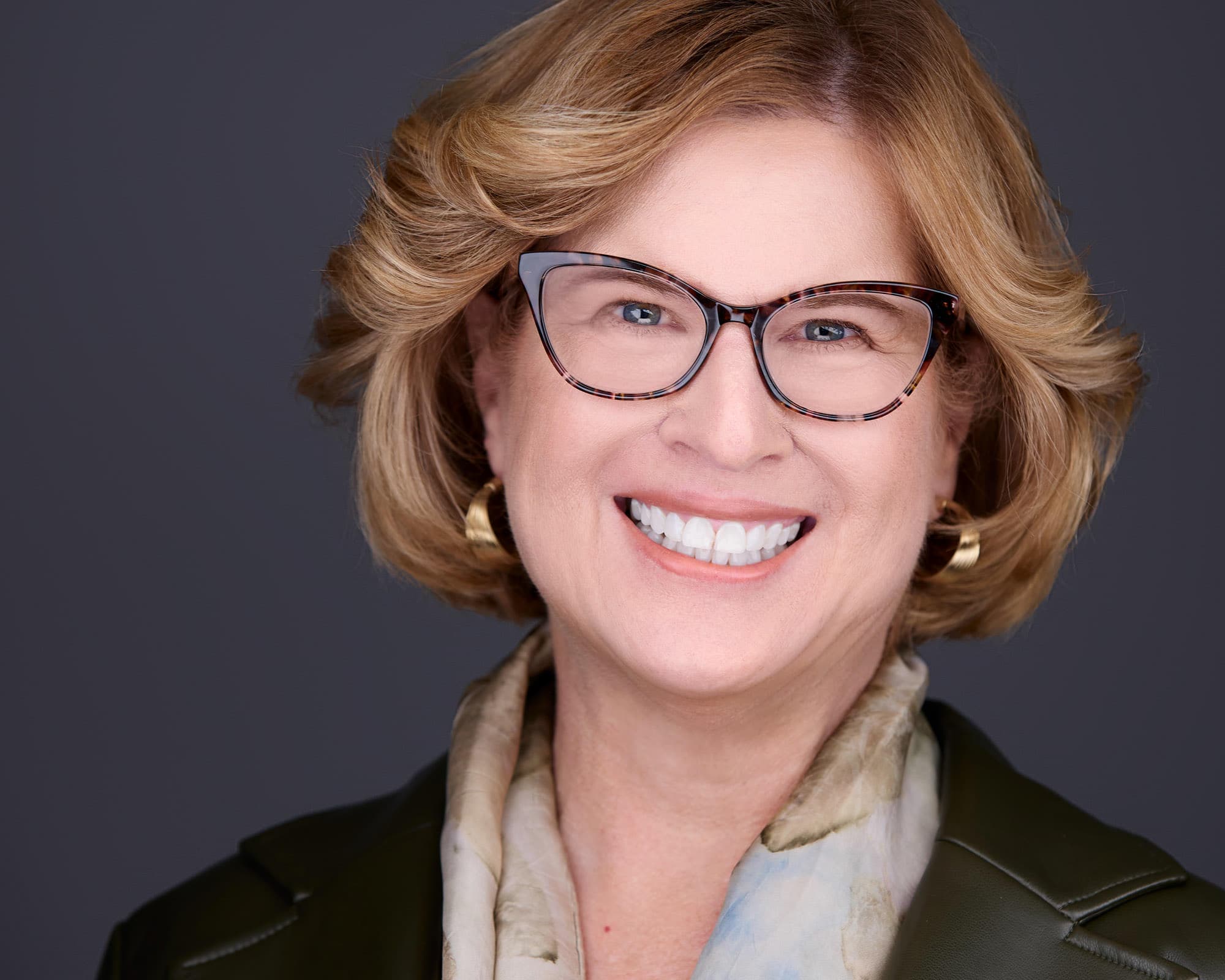 Executive headshot of woman in professional blazer