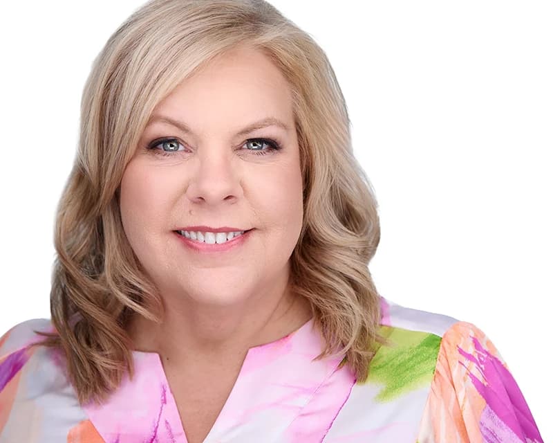 Women's headshot in elegant neutral tones