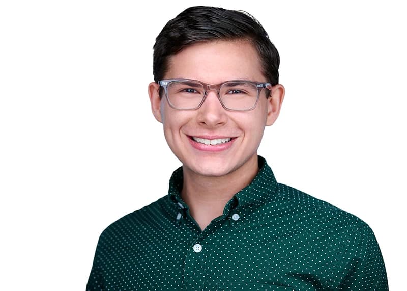 Professional headshot of man wearing glasses
