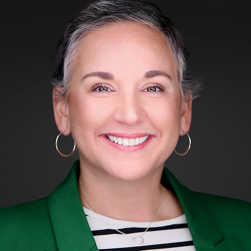 Professional headshot wearing Green