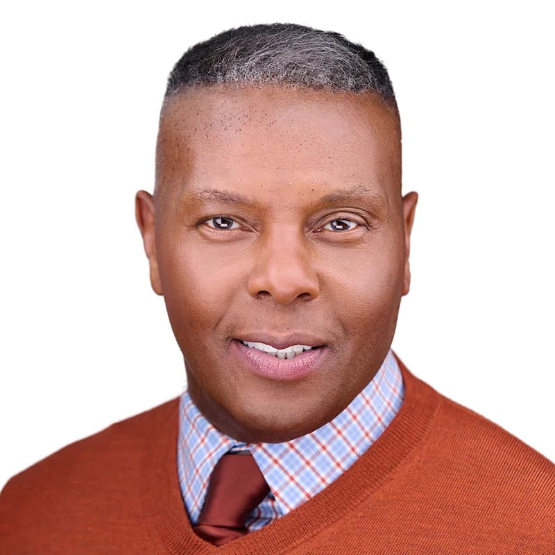 Professional headshot wearing Orange