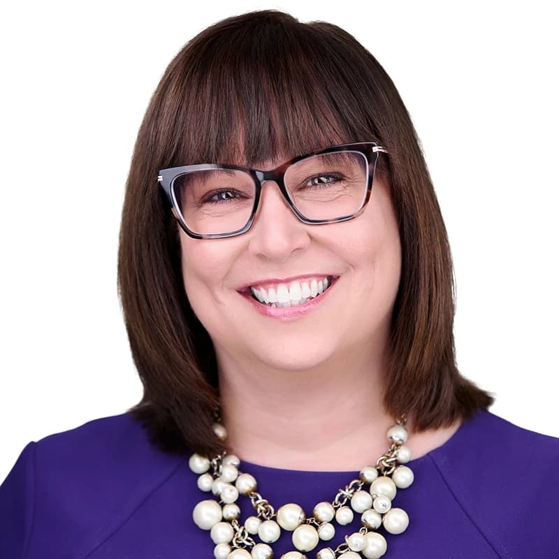 Professional headshot wearing Violet