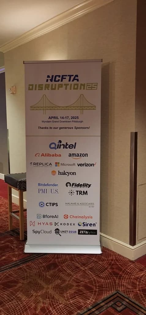 Conference sponsor banner at headshot lounge
