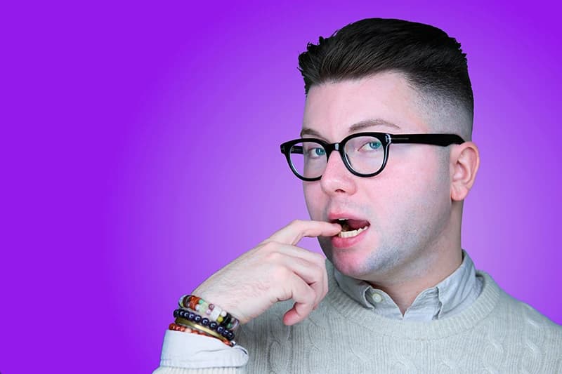 Professional headshot with purple background