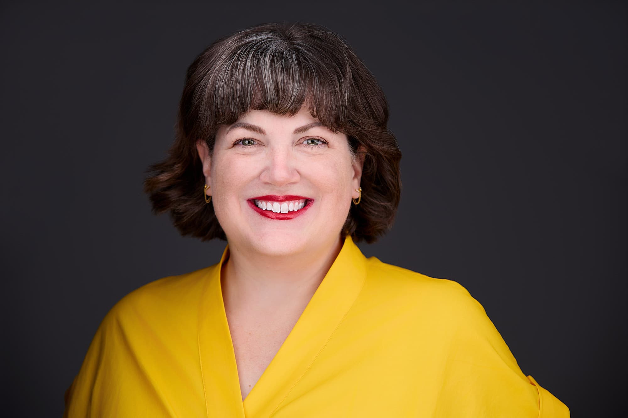 Professional business headshot of female executive