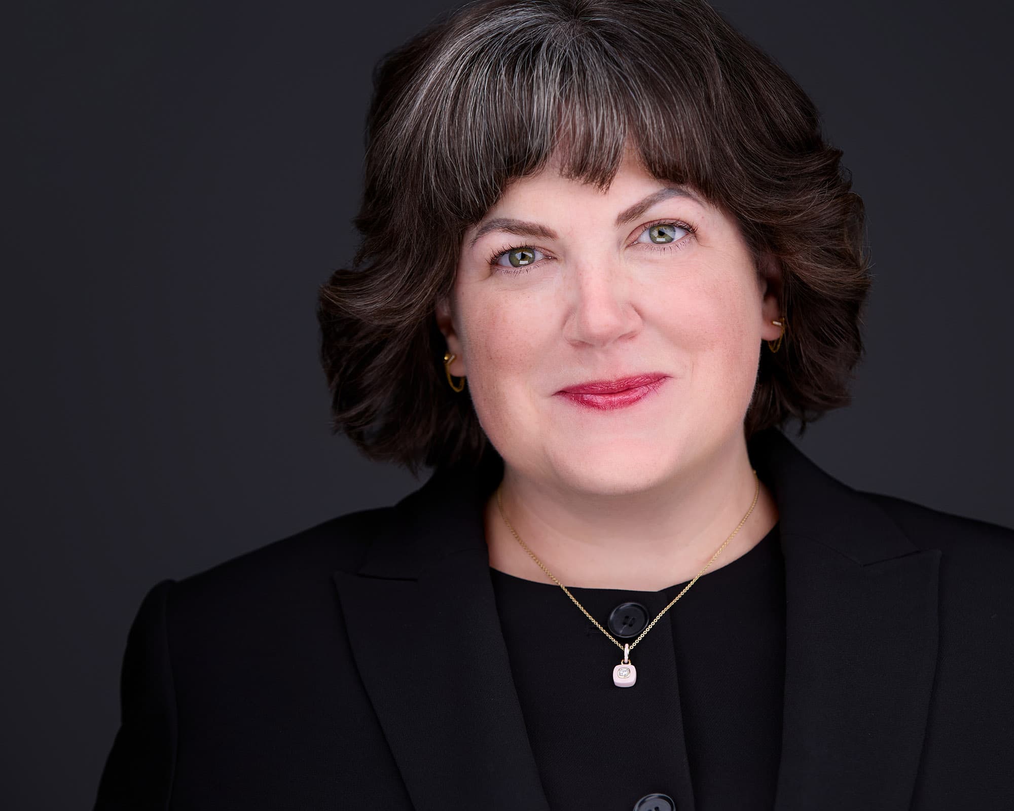 Corporate headshot with confident expression