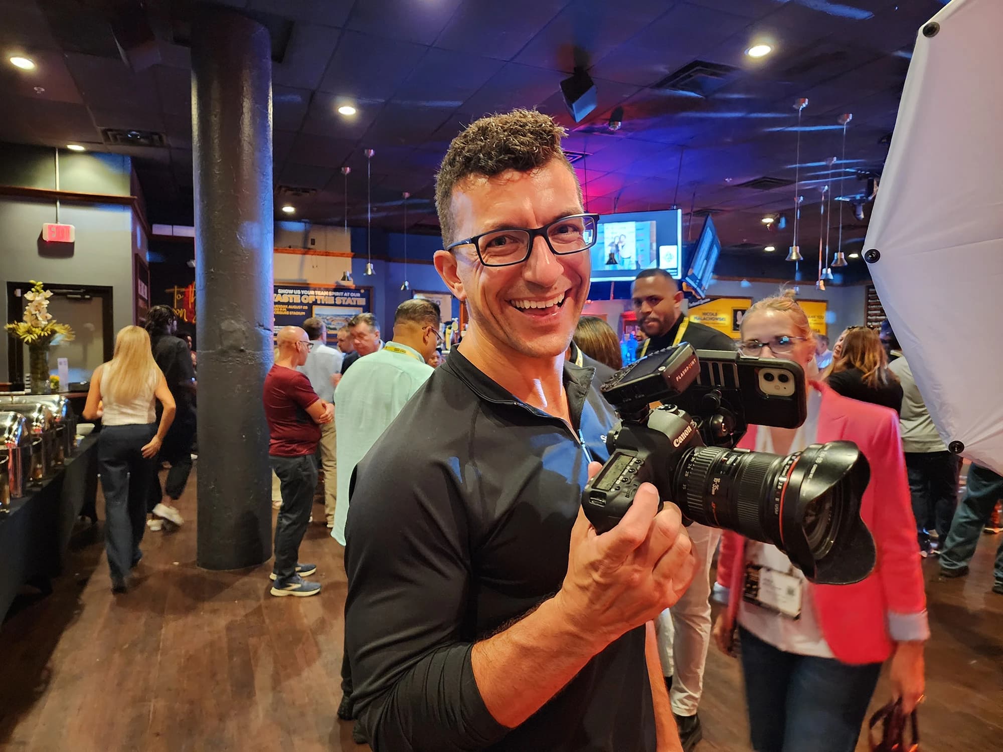 Conference photographer Chad Isaiah capturing event moments