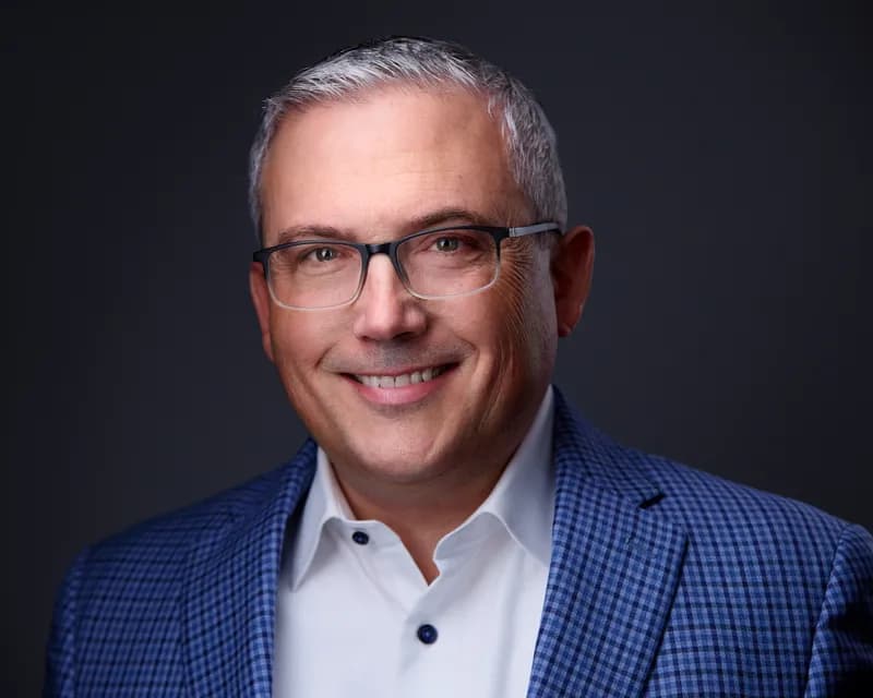 Corporate portrait of male professional with studio lighting