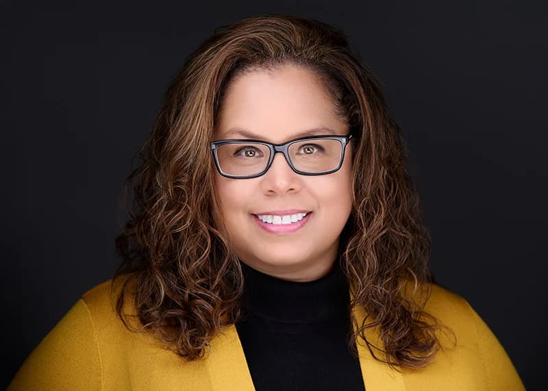 Mental health therapist headshot in a soft cardigan with a genuine smile - Pittsburgh practice photography