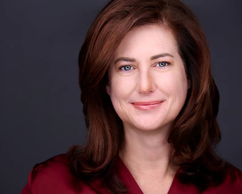 Business woman headshot in a natural confident pose