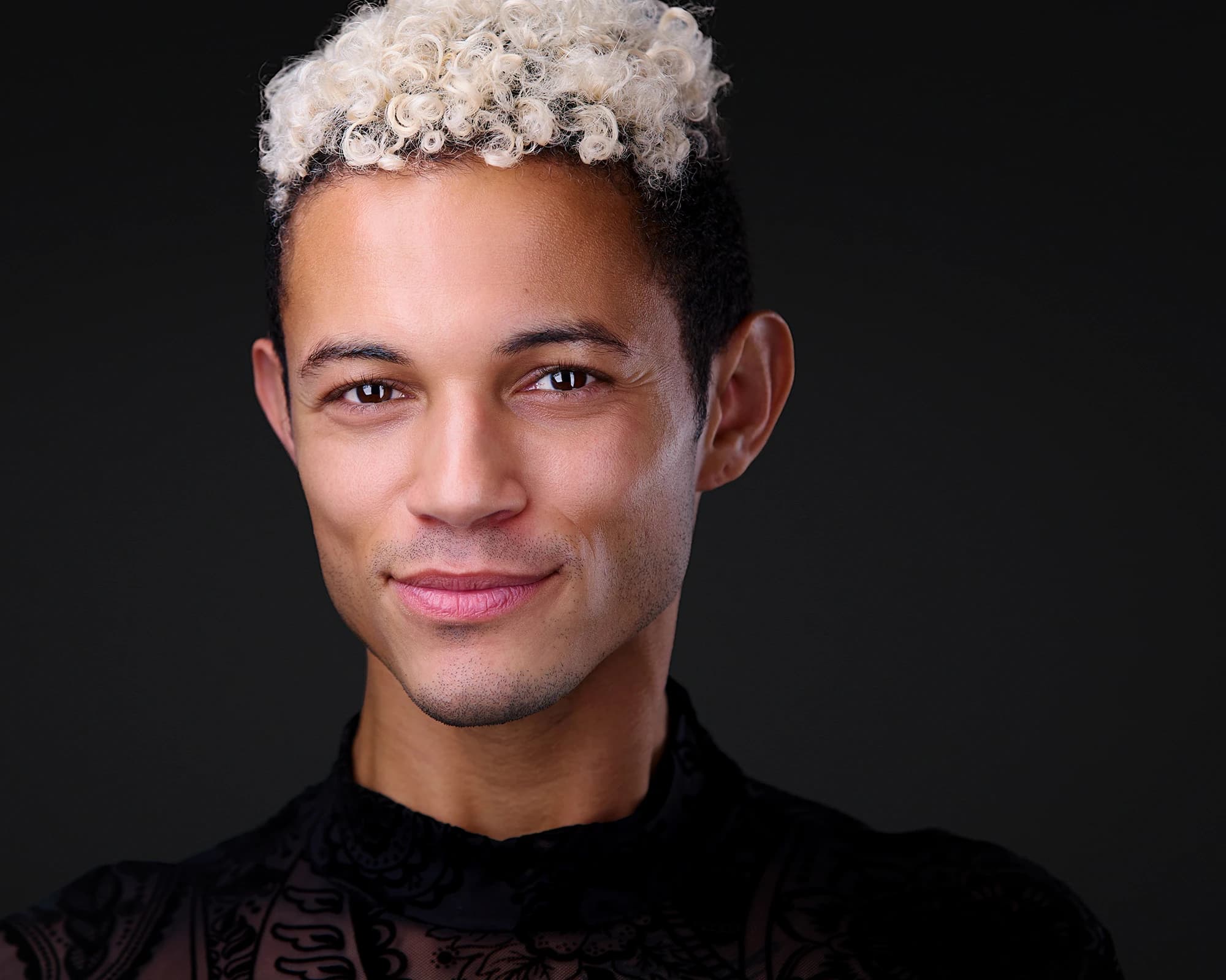Modern professional headshot of man with creative styling