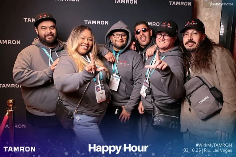 Conference attendees at professional step and repeat photo booth setup