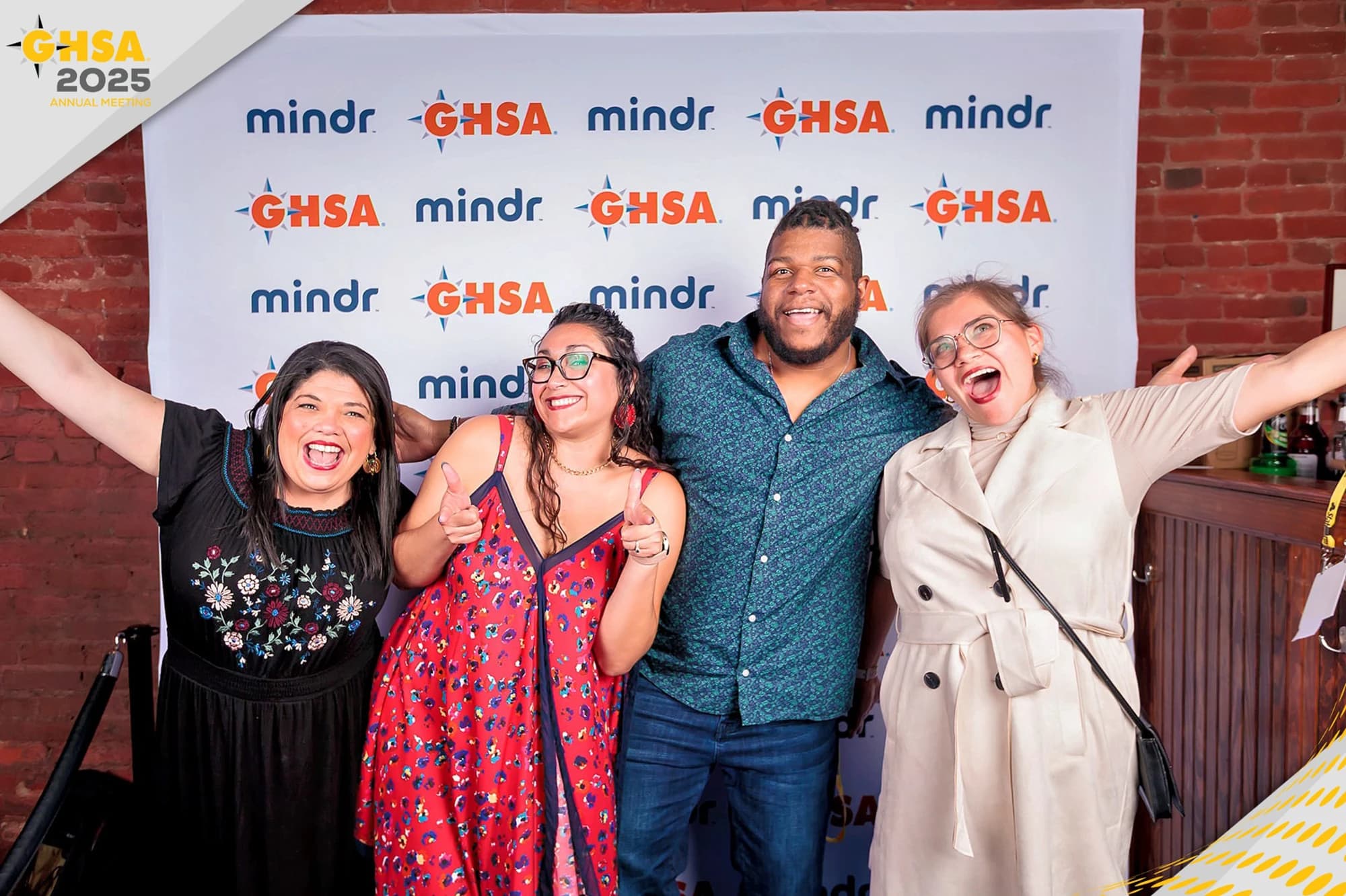 Gala attendees at branded step and repeat backdrop photo experience