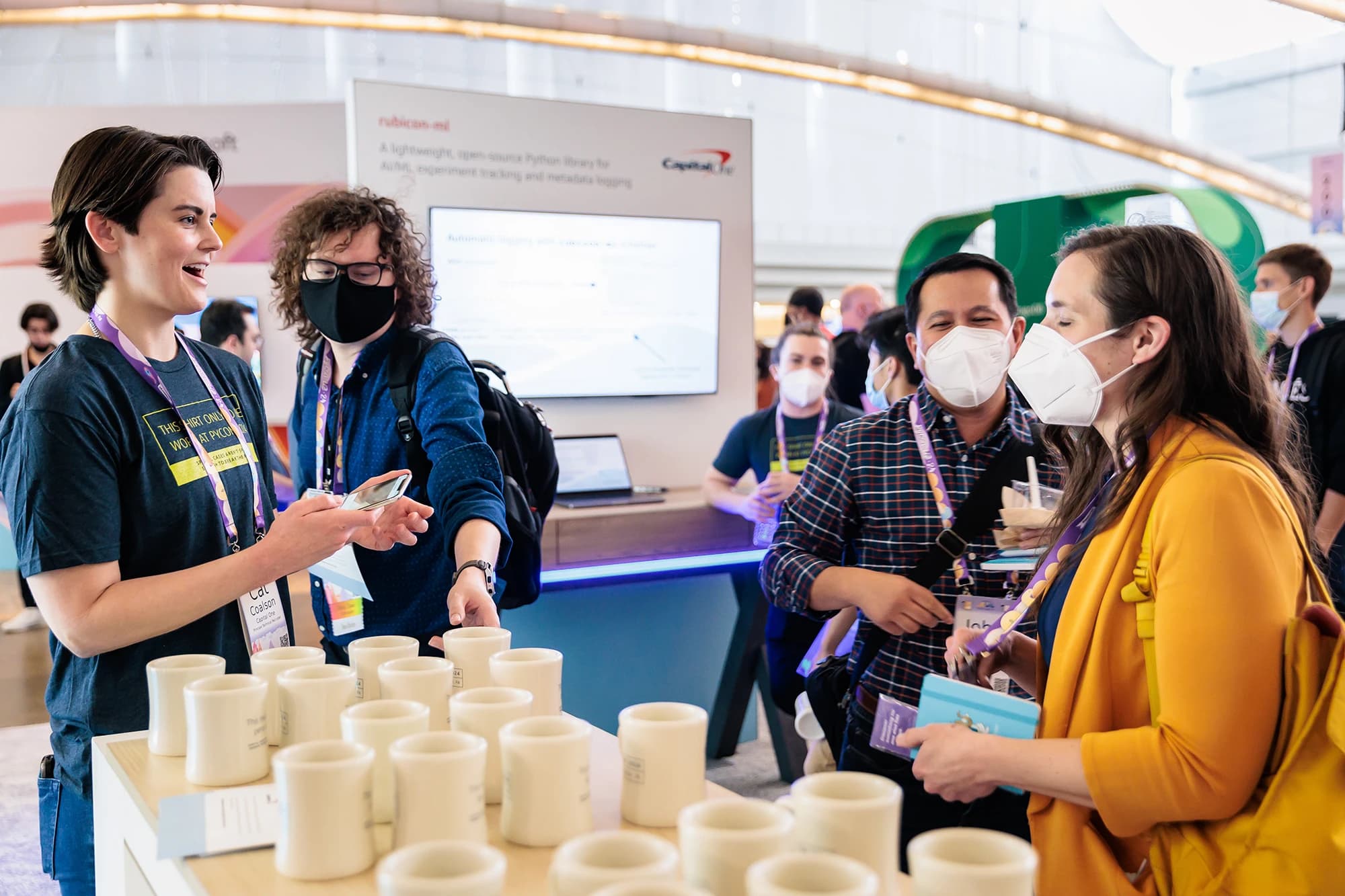 PyCon 2024 sponsor booth with tech company displays