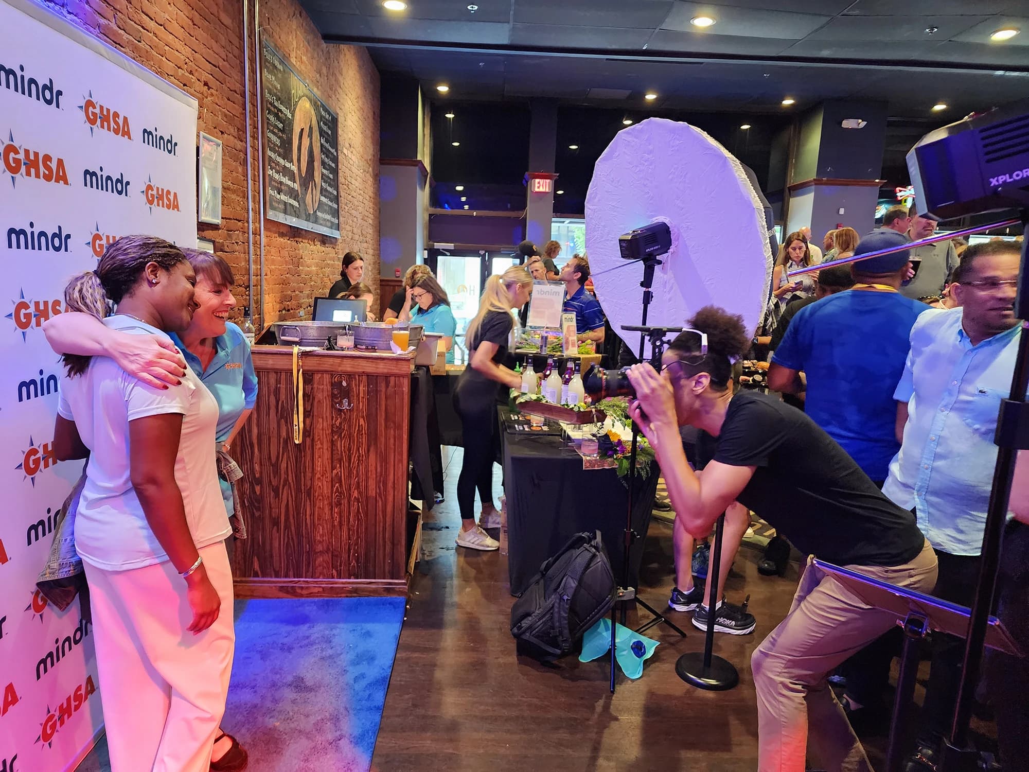 Professional step and repeat photography setup with lighting and branded backdrop at Pittsburgh event